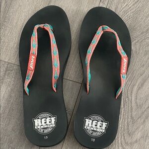 Reef Black and Teal Flip Flops with Coral Accents